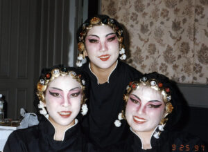 Three actors in face markup from the play "Dragonwings."